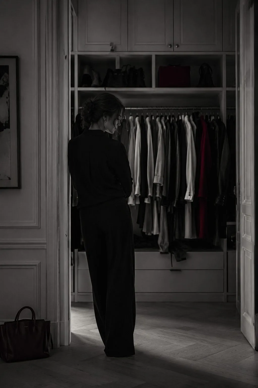 Woman in front of a full wardrobe, nothing to wear